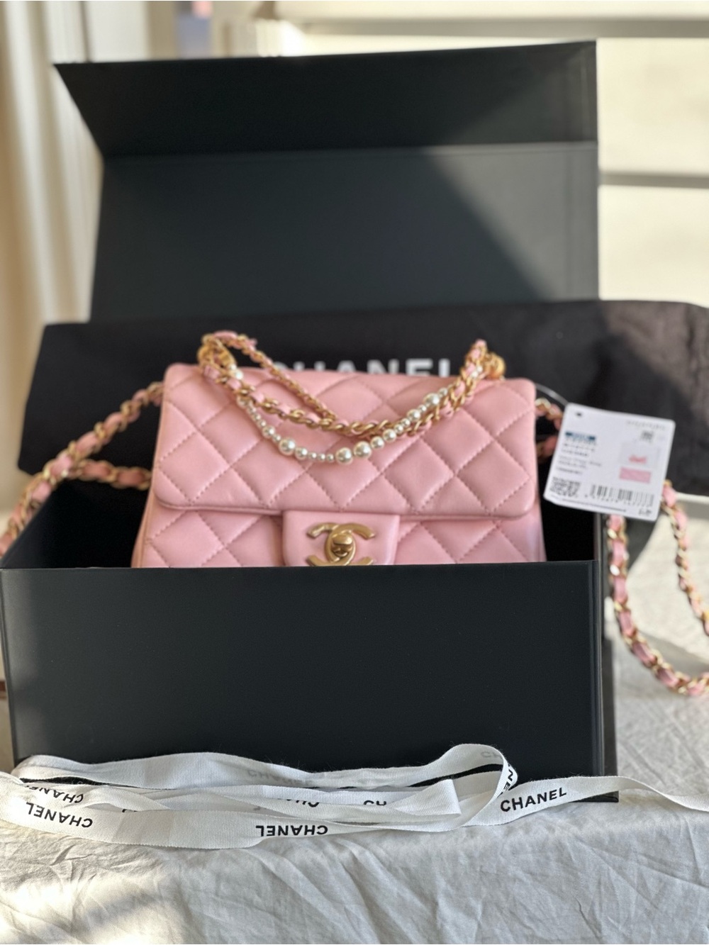 CHANEL Pink Quilted Mini Flap Bag with Pearl-Accented Chain